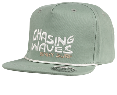 The Chasing Snapback Hat is the perfect accessory for surf and beach lovers of all ages. Featuring an all-teal/green design with an embroidered "Chasing Waves BNKY Surf" logo on the front, this stylish hat is made from 100% high-quality cotton for comfort and durability. Available in infant, toddler, youth, junior, and adult sizes, it’s a great fit for the whole family. Whether you’re hitting the beach or enjoying a casual day out, this snapback hat combines coastal vibes with everyday functionality. Perfec