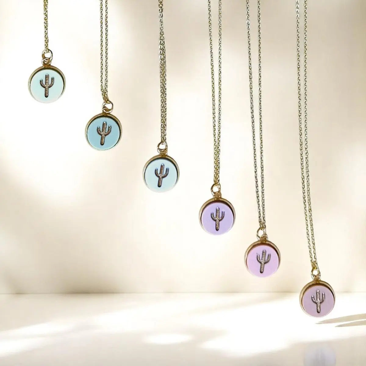 Close-up of Miminoo Jewelry 18K gold cactus charm necklace with summer pastel beads – perfect for beach outfits and gifts.