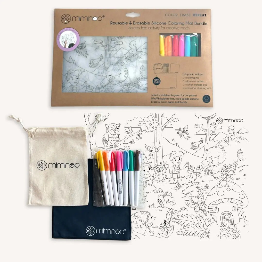 Miminoo Enchanted Forest silicone reusable coloring tablemat set with Hansel and Gretel, forest animals, and magical fairies for kids age 4+ with a set of colorful markers, storage bag and wiping cloth packaged in a cardboard backing with 'Miminoo' branding.