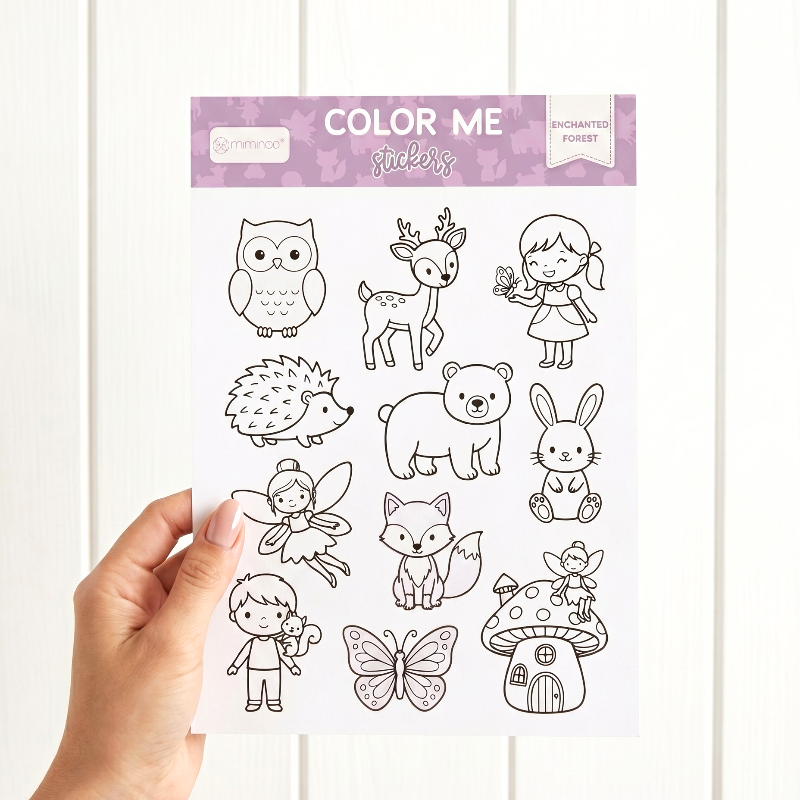hand holding a color me sheet of enchanted forest theme animals and characters by miminoo