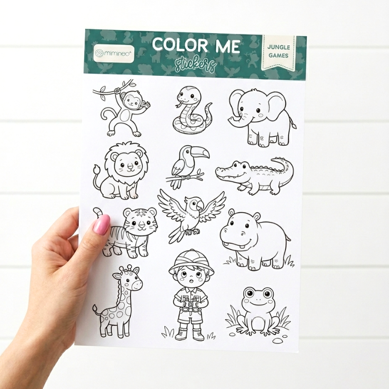 Sheet of jungle-themed stickers with a hand holding it against a white background
