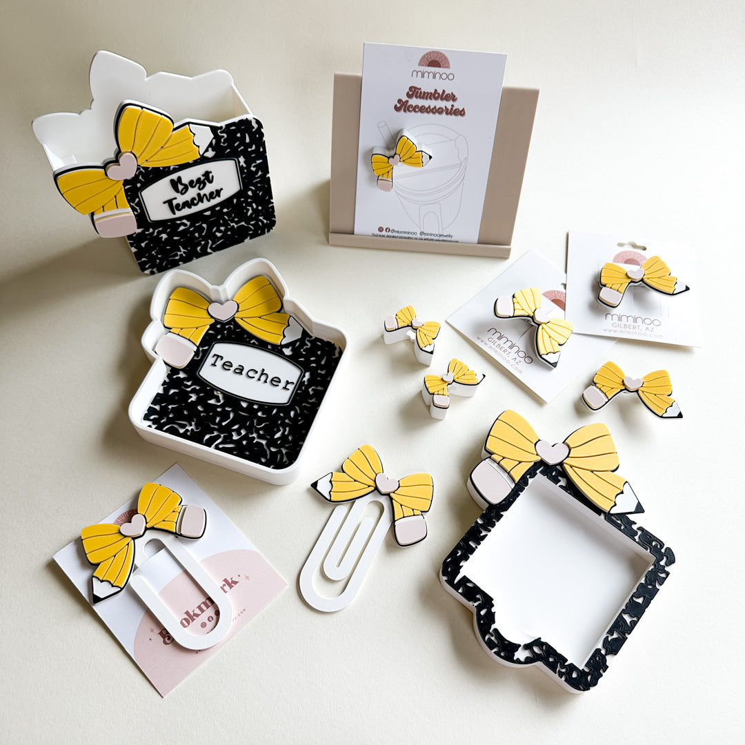 Collection of decorative items with yellow bows on a light background
